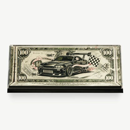 LUXEMARK Clear display case with banknote-inspired car artwork, green ornament and pink accents
