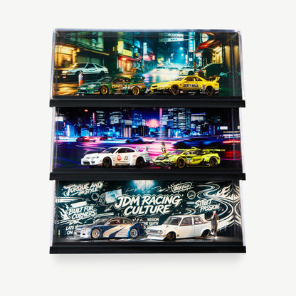 Three stacked LUXEMARK 1:64 JDM display cases with Tokyo street, night highway and Racing Culture backdrops